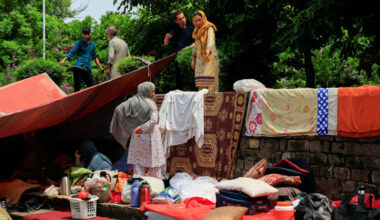 Evicted Afghan refugees huddle in Islamabad park, dreading return home