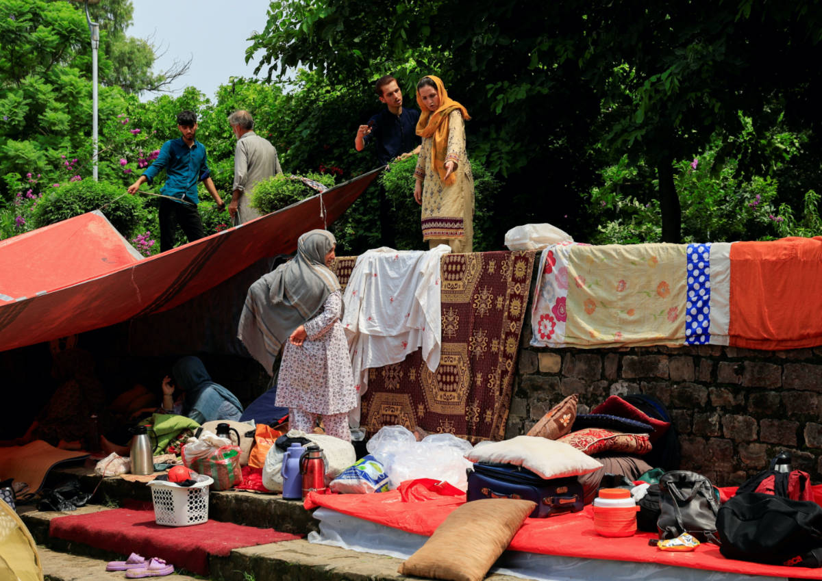 Evicted Afghan refugees huddle in Islamabad park, dreading return home
