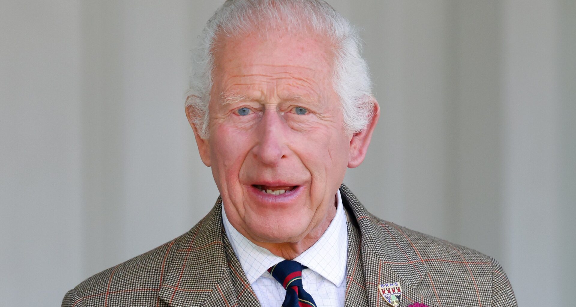 King Charles III (wearing a Royal Marines tie) attends The Braemar Gathering 2024 at The Princess Royal and Duke of Fife Memorial Park on September 7, 2024