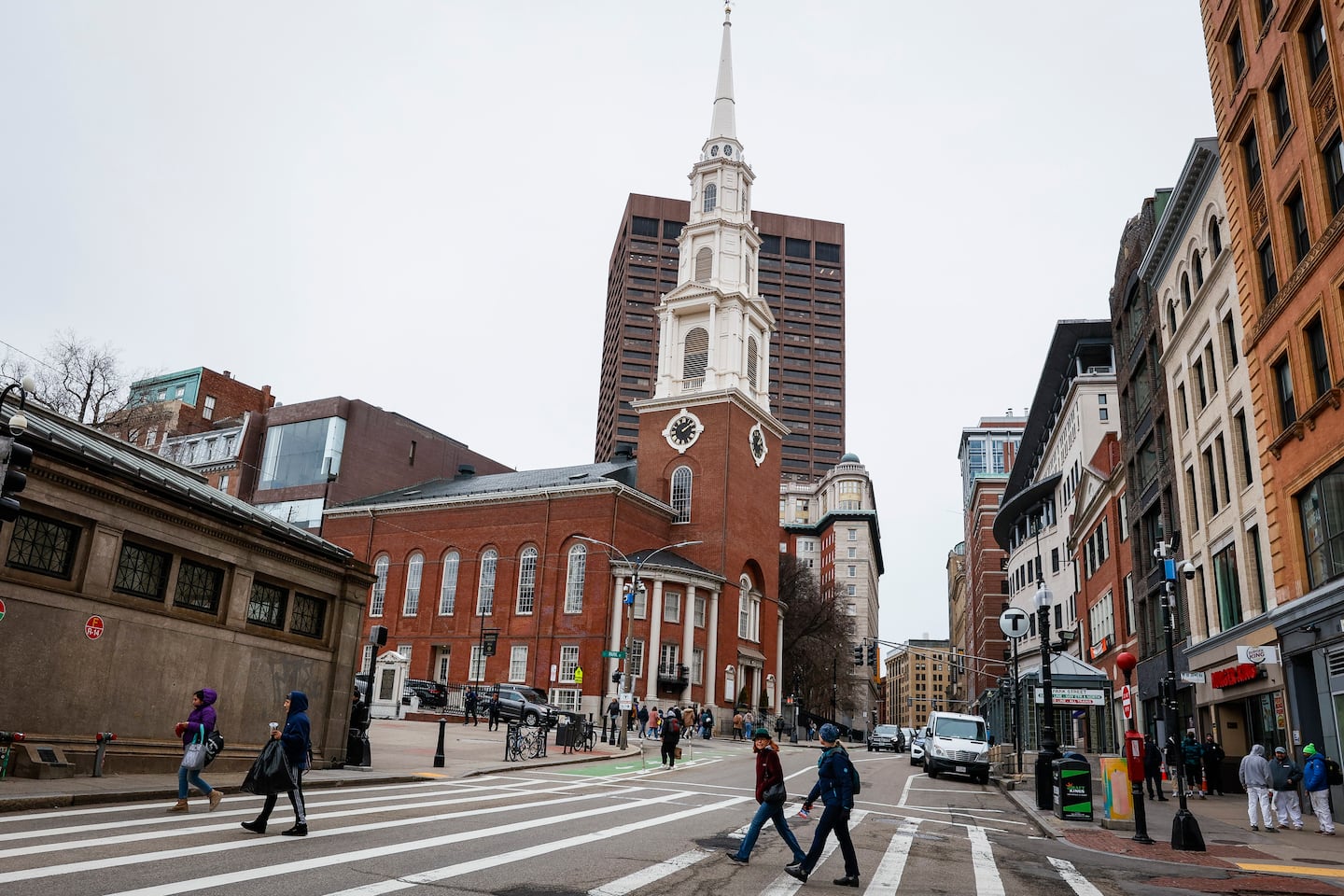 Pedestrians walked across Tremont Street, near the Park Street Church, in downtown Boston.