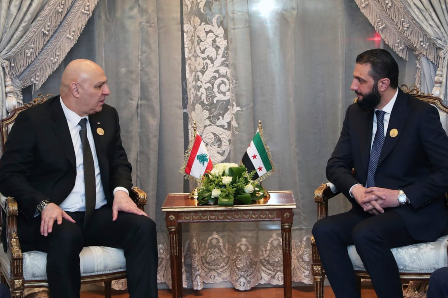 In this photo released by the Lebanese Presidency press office, Lebanese president Joseph Aoun, left, meets with Syria's interim President Ahmad al-Sharaa during the emergency Arab summit at Egypt's New Administrative Capital, just outside Cairo on March 4.