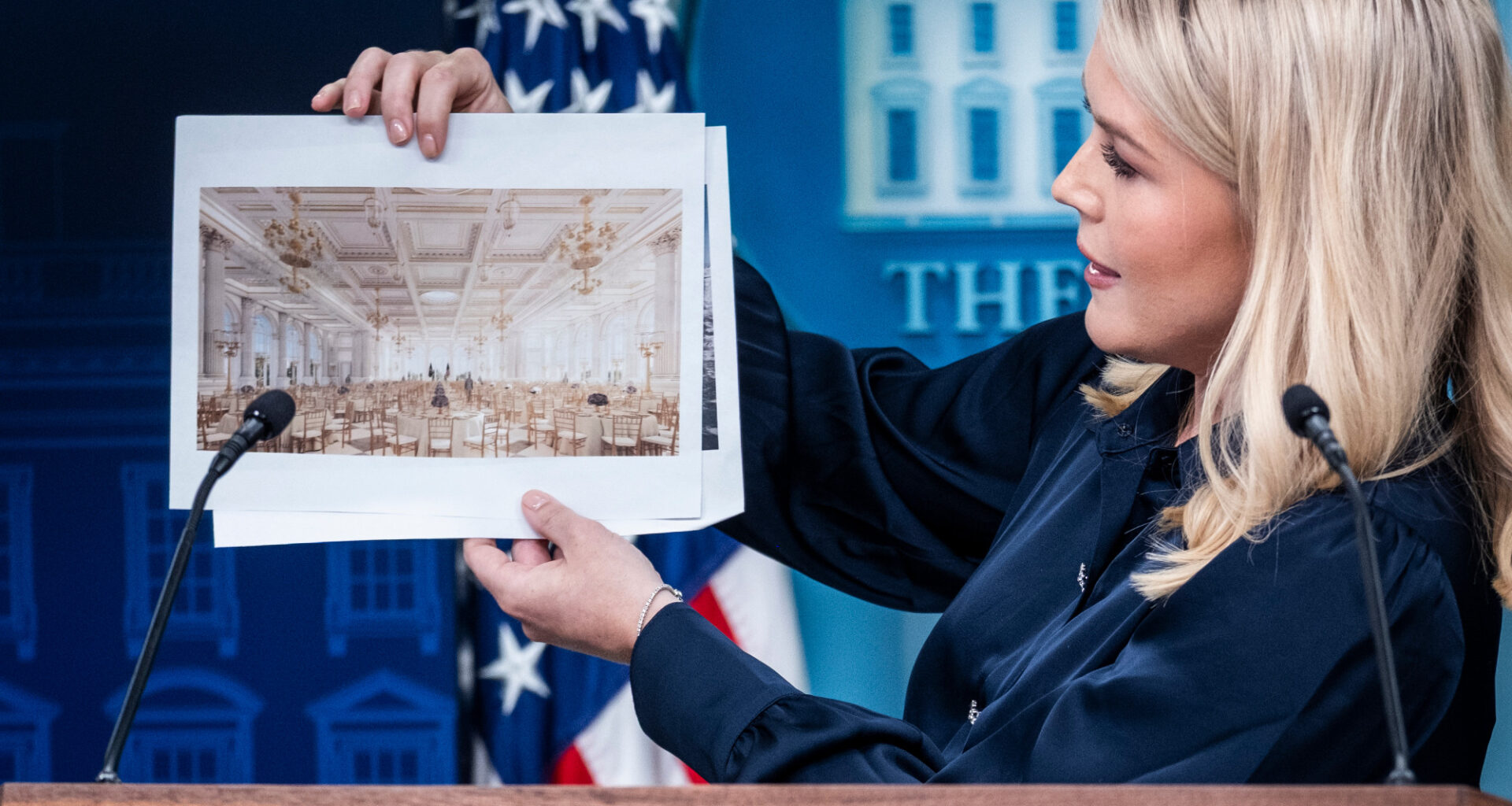 White House Press Secretary Karoline Leavitt holds up renderings of the proposed White House Ballroom during a press briefing