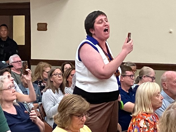 A protester addresses U.S. Rep. Sean Casten at the beginning of his town hall meeting at La Grange Village Hall July 30, 2025. (Hank Beckman/for Pioneer Press)