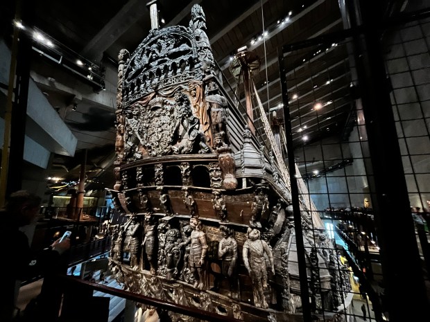 An ornate ship stern, covered in wooden statues