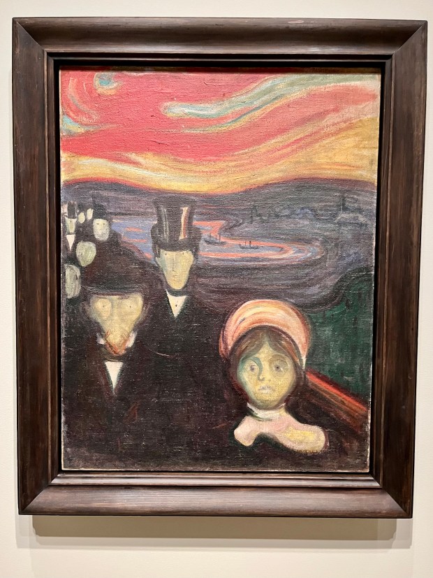 A painting in which the three subjects in the foreground have haunting, wide-open eyes