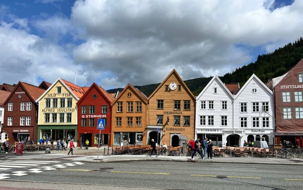 Colorful row houses with a street in front of them