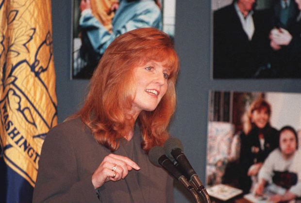 Sarah Ferguson, the Duchess of York, speaks at the National Press Club 07 December in Washington. The Duchess was in Washington to talk about her newly formed American charity called Chances for Children. (COLOR KEY: Red hair). (Photo by JOSHUA ROBERTS / AFP) (Photo by JOSHUA ROBERTS/AFP via Getty Images)
