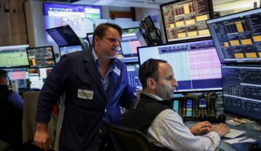 Traders work on the floor at the New York Stock Exchange (NYSE) in New York City, U.S., July 1, 2025. (Reuters/Jeenah Moon)