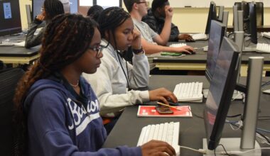 Students sit in a computer lab to work on their data-analysis projects during the AR Health Data Scholars’ Summer Bootcamp in Little Rock.