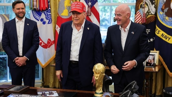 U.S. President Donald Trump stands with Vice President JD Vance and FIFA president Gianni Infantino, as President Trump makes an announcement on the 2026 FIFA World Cup, in the Oval Office at the White House in Washington, D.C., U.S., August 22, 2025. REUTERS/Jonathan Ernst(REUTERS)