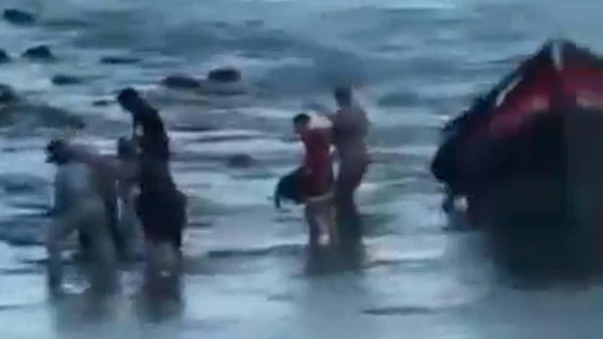 Dozens of migrants land on Algarve beach loved by Brits... and are immediately taken before judge and ordered to leave the country, in stark contrast to soft-touch UK