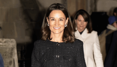 Pippa Middleton wearing a sparkly black coat and smilig