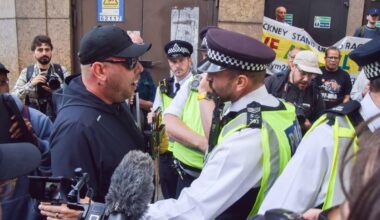 Police officer 'punched in the face' by masked protester at anti-asylum march in London