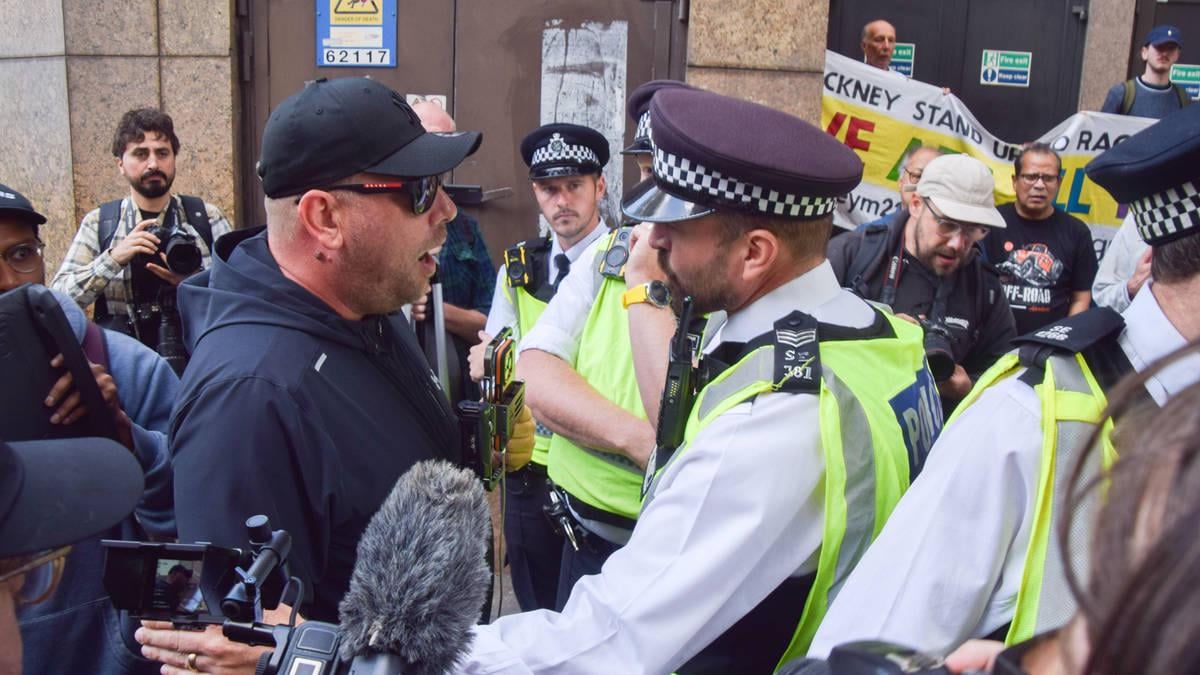 Police officer 'punched in the face' by masked protester at anti-asylum march in London