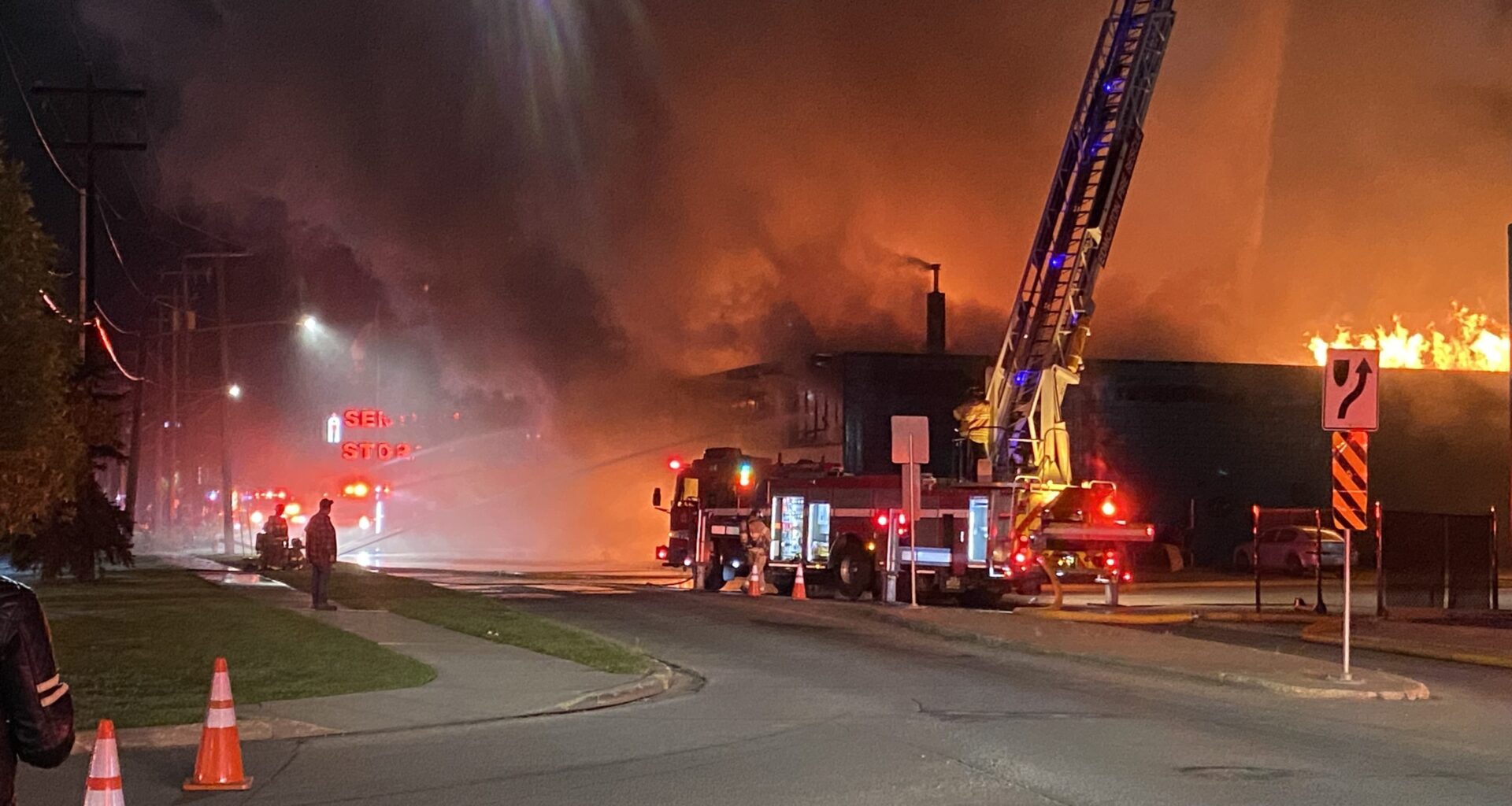 Crews work to extinguish massive warehouse fire in north central Edmonton