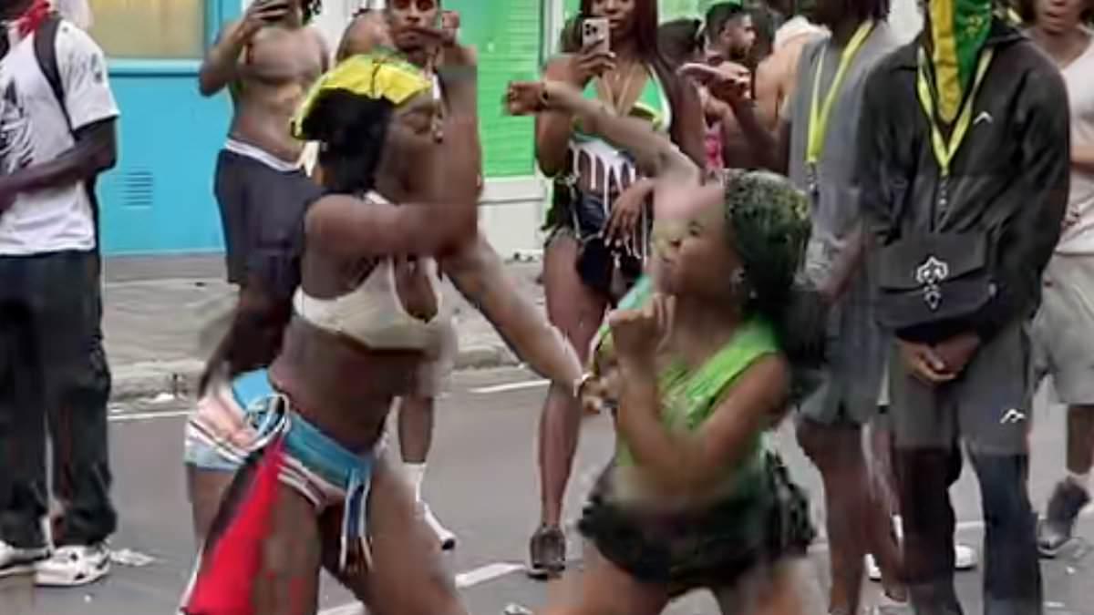 Moment women brawl in the street at Notting Hill Carnival - as police arrest 140 people on first day