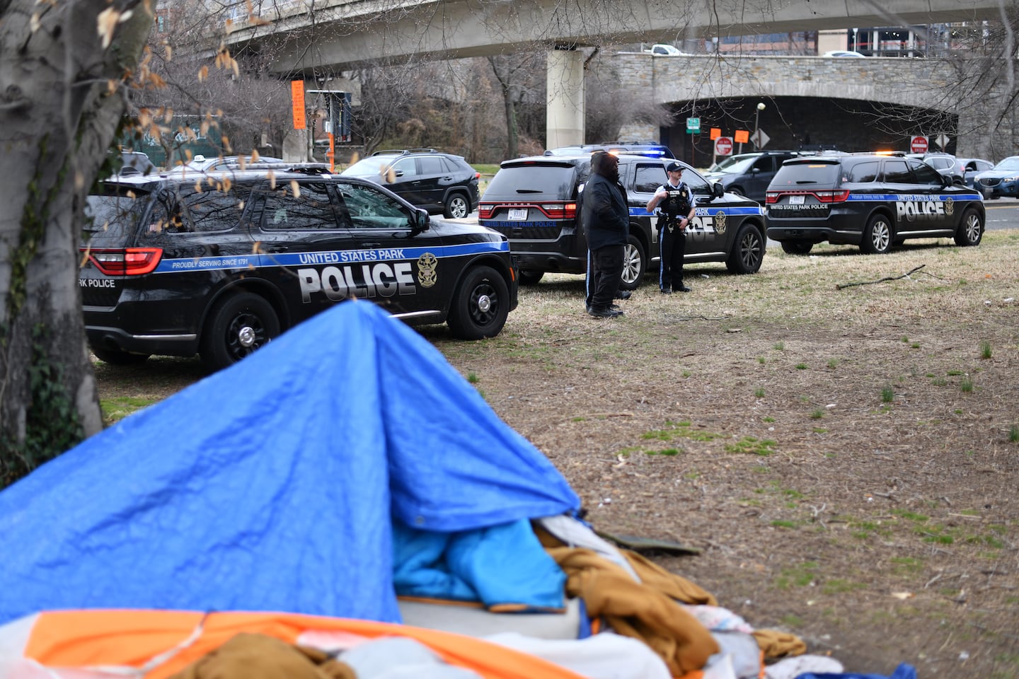 National Park Police monitor a homeless encampment in Foggy Bottom in Washington, D.C., on March 14.