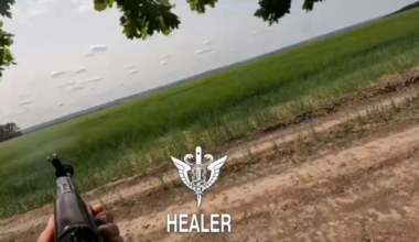 A Russian soldier captures first-person footage of an approaching Ukrainian "Darts" fixed-wing UAV as he attempts to shoot it down with his rifle.
