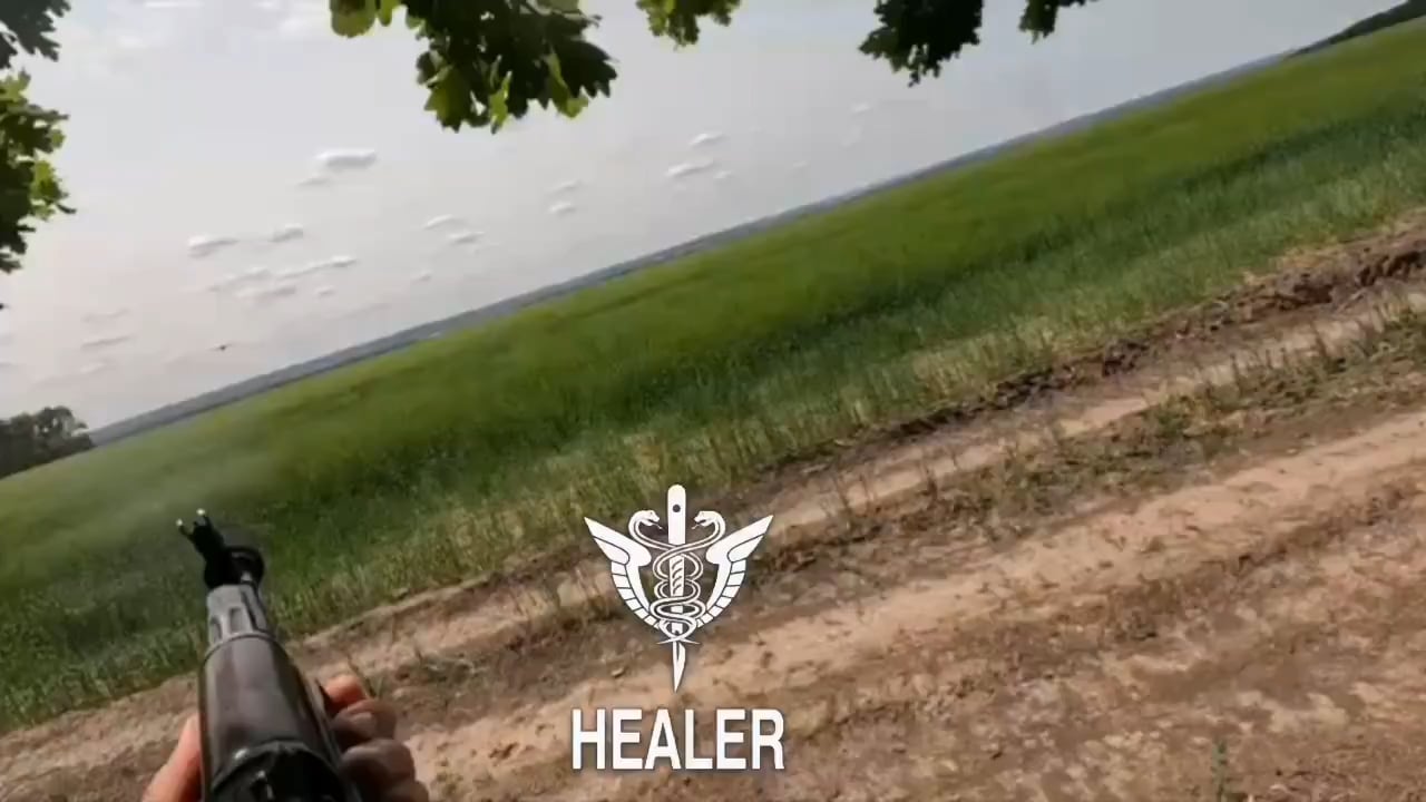 A Russian soldier captures first-person footage of an approaching Ukrainian "Darts" fixed-wing UAV as he attempts to shoot it down with his rifle.