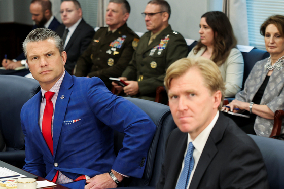 U.S. Defense Secretary Pete Hegseth, left, seated with Elbridge Colby, U.S. under secretary of defense for policy, right, meets with Philippine President Ferdinand Marcos Jr., not pictured, at the Pentagon in Washington on July 21. [REUTERS/YONHAP]