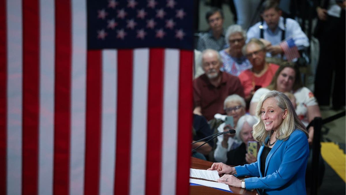 Spanberger at right, US flag dominates image