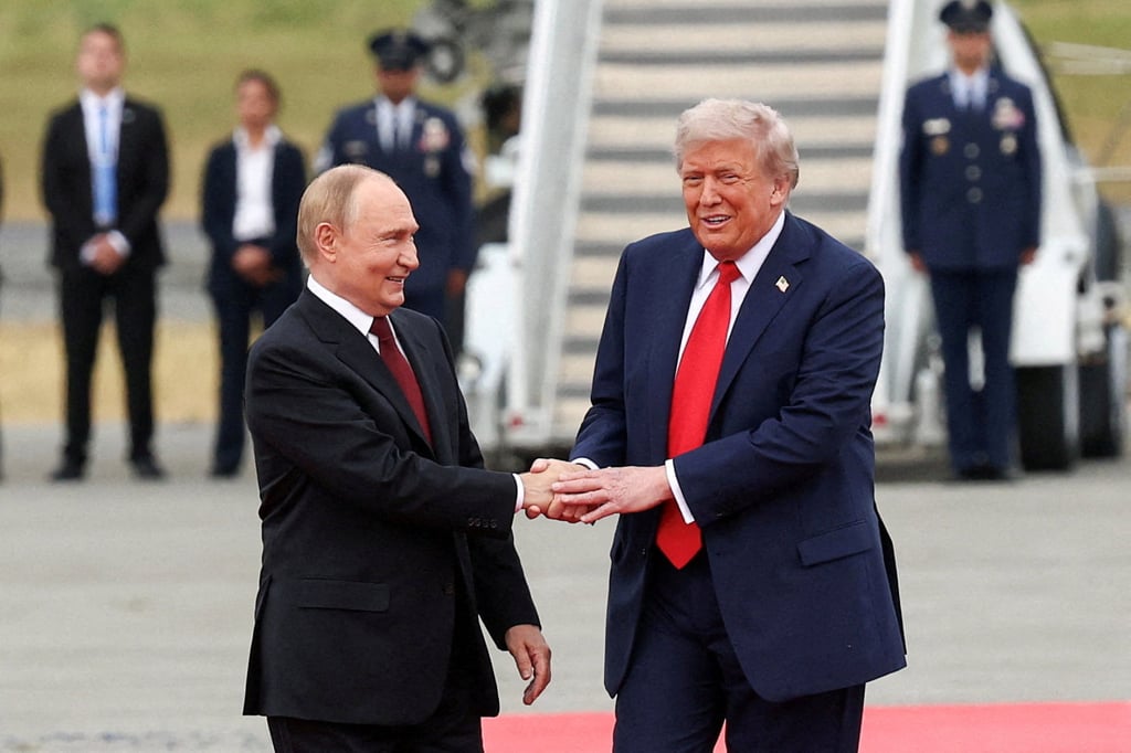 US President Donald Trump shakes hands with Russian President Vladimir Putin in Alaska on Friday. Photo: Reuters