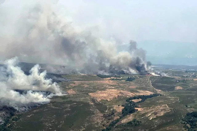 This recent photo taken from a French Canadair water bomber by the Securite Civile shows a wildfire in Spain