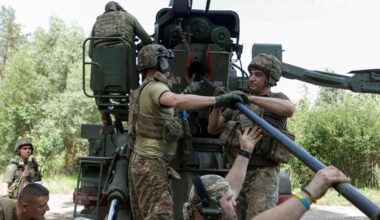 Ukrainian servicemen loading a shell into a self-propelled howitzer before firing towards Russian troops, in Ukraine's Kharkiv region, on July 27.