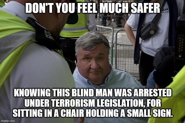 This unbelievably dangerous terrorist was arrested *Checks Notes*... what, are you sure?.. this blind man sat quietly in a chair was arrested for terrorism.
