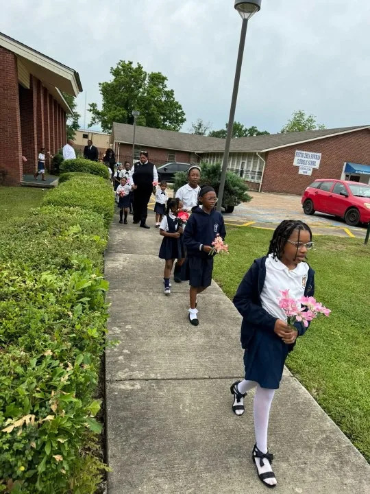 Sister Thea Bowman Catholic School Students participating in the Crowning of Mary ceremony which honors the life of Mary in May 2025 (Courtesy: Chris Payne)