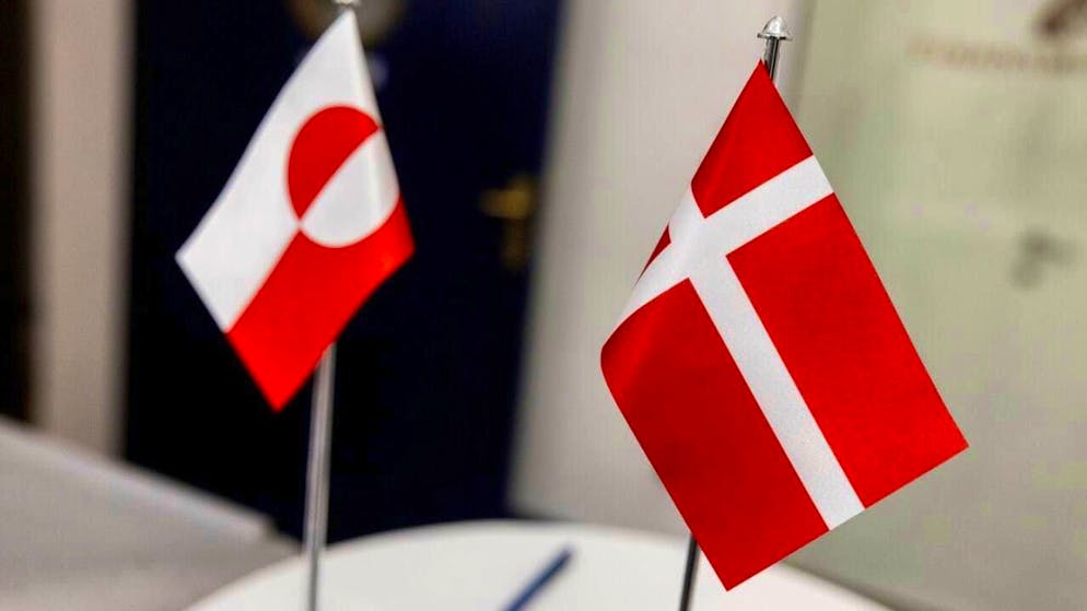 ARCHIVE - The flag of Greenland (l) can be seen together with the flag of Denmark. Photo: Nikolai Linares/Ritzau Scanpix Foto/dpa