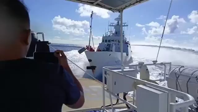 Chinese Coast Guard ship collides with People's Liberation Army Navy ship while chasing Philippine Coast Guard ship.