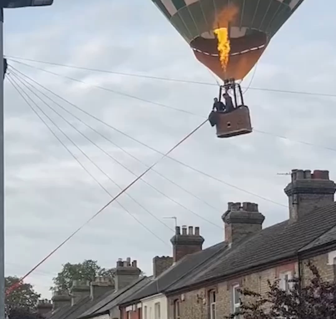 Hot air balloon lands in residential street