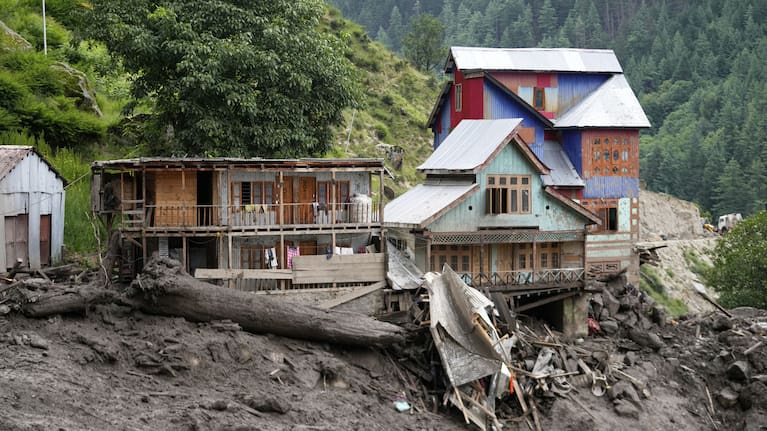 Buildings damaged by Thursday's flash floods are seen in Chositi village.