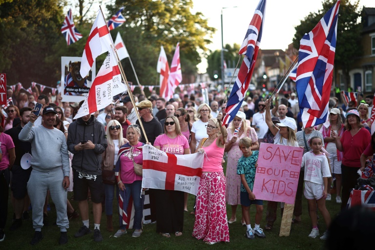 Anti-immigration protesters gather outside the Bell Hotel, currently holding many asylum seekers, in Epping, England earlier this month. (Photo: AFP)