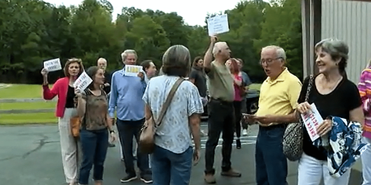 'Escorted into a car': GOP Congressman flees Alabama voters after making event private