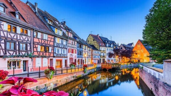 Colmar, Alsace, France. Petite Venice, water canal and traditional half timbered houses.