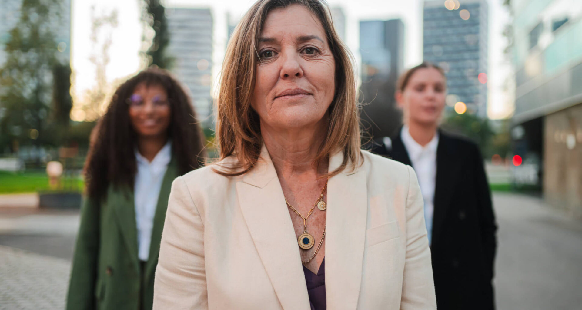 confident female leader standing outdoors