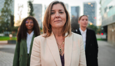 confident female leader standing outdoors