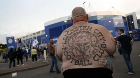 Adrian Webber/ Getty Images Lee Jobber, faced away from the camera with a Leicester City tattoo on his back