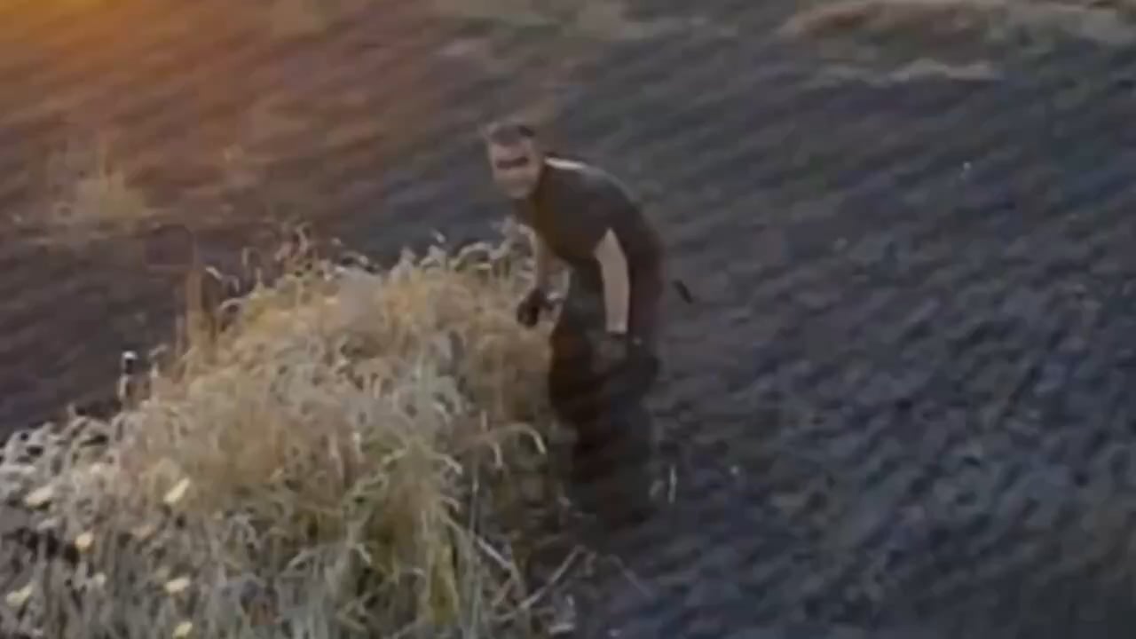 Russian soldier having failed to hide from a Ukrainian FPV drone decides to ram it with his head. 2025