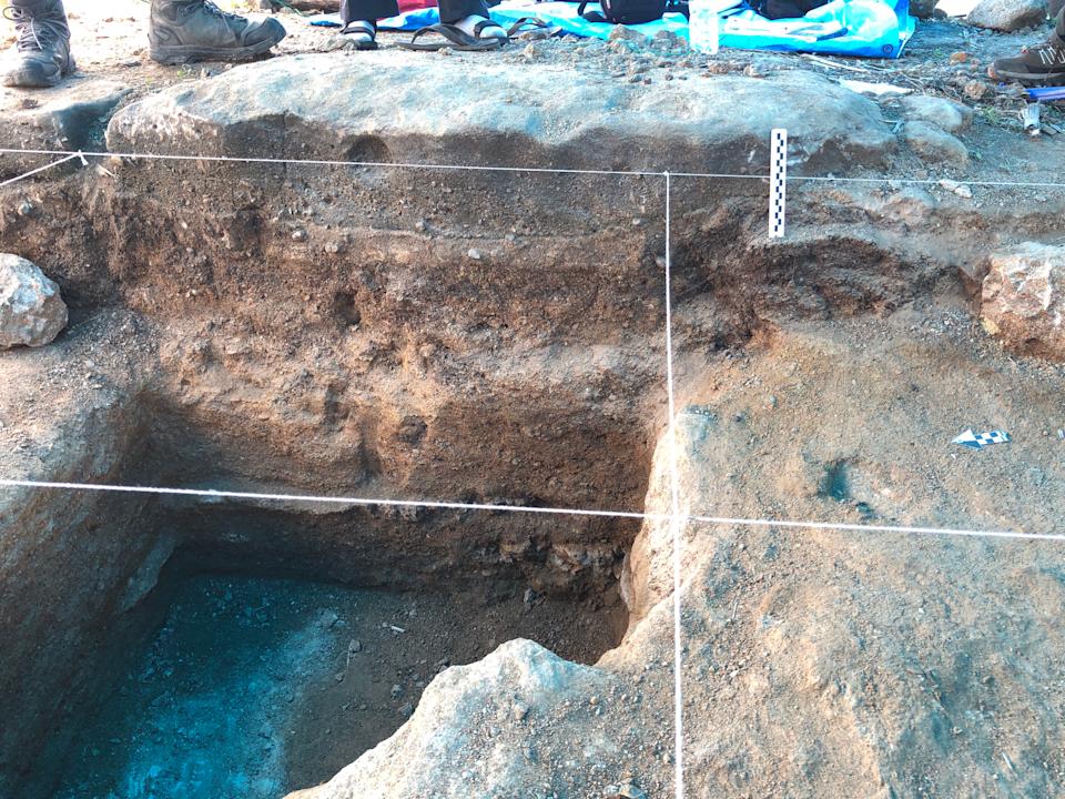 Looking inside the Calio dig.