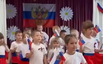 Footage of Ukrainian children in occupied Enerhodar obliged to praise the Russian Empire during the National Flag Day today.
