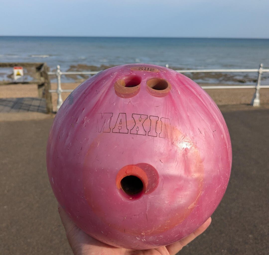 Went to Bexhill-on-Sea today, and walking on the beach at low tide I found a bowling ball which looked for all the world like it had just been bowled there.