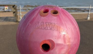 Went to Bexhill-on-Sea today, and walking on the beach at low tide I found a bowling ball which looked for all the world like it had just been bowled there.