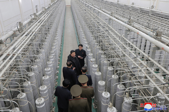 North Korean leader Kim Jong-un, second from top, inspects a nuclear-material production base with officials, in this file photo published by the Korean Central News Agency on Jan. 29. [KOREAN CENTRAL NEWS AGENCY]