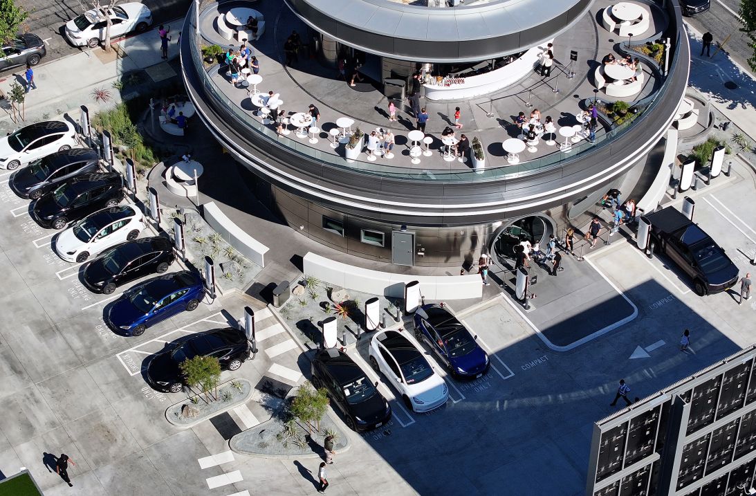 The newly opened Tesla Diner with Teslas parked at Superchargers on July 31, 2025, in Hollywood, California. The retro-futuristic 24-hour diner and supercharging station is located on historic Route 66 and features two 66-foot movie screens and 250 seats for dining.