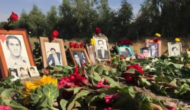 Families of 1988 massacre victims place flowers and photos at Khavaran, a site long known as the burial ground of the regime’s atrocities and fallen freedom fighters