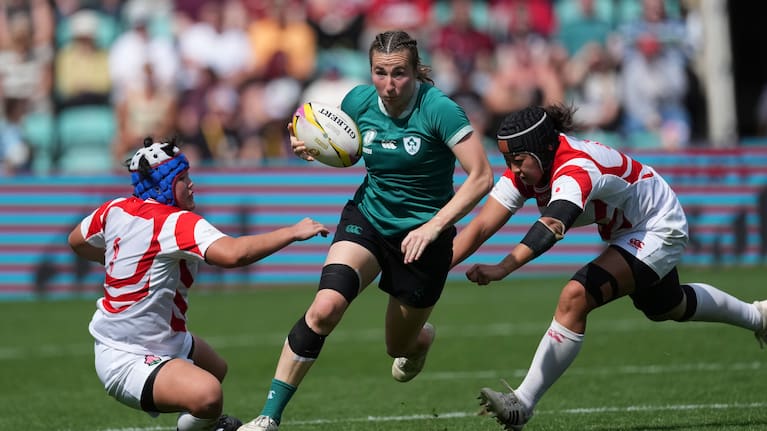 Ireland's Eve Higgins, evades a tackle during the group C match between Ireland and Japan of the 2025 Women's Rugby World Cup, in Northampton.
