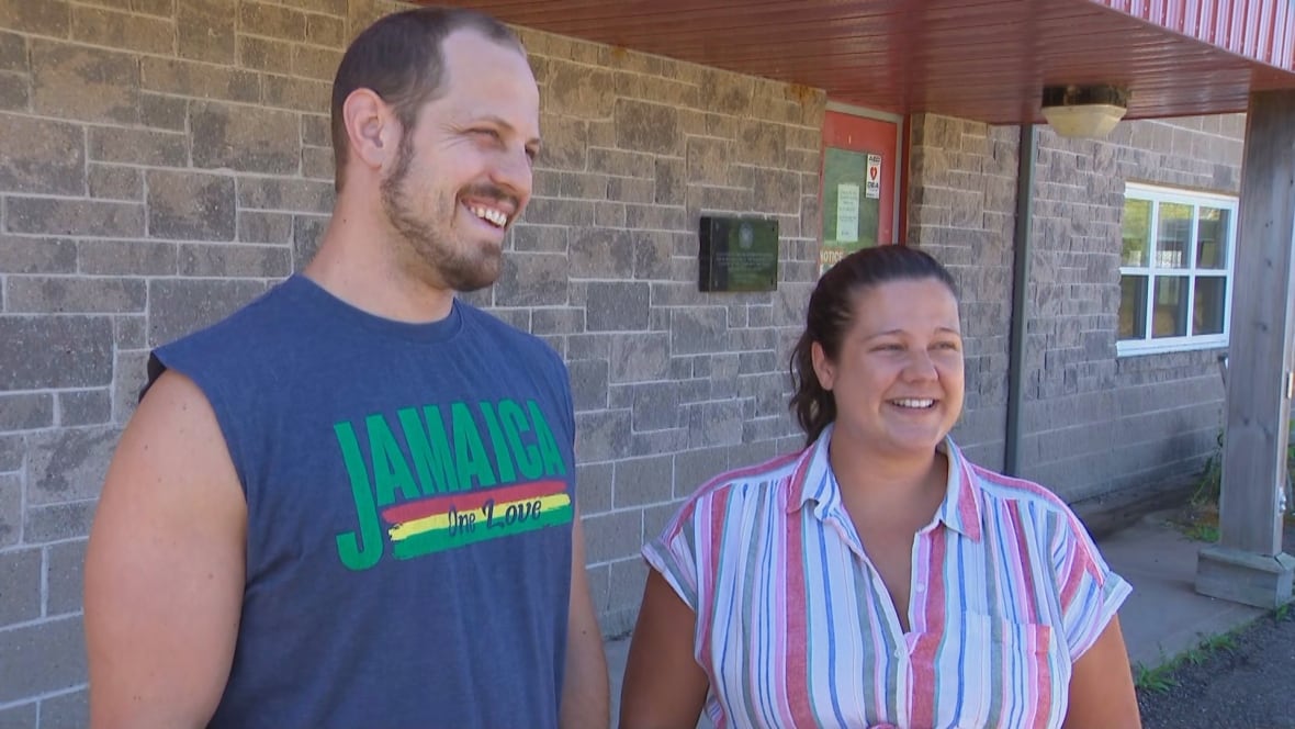 Micahel and Meghan stand outside an emergency reception and shelter set up at the Bridgetown Fire Hall.